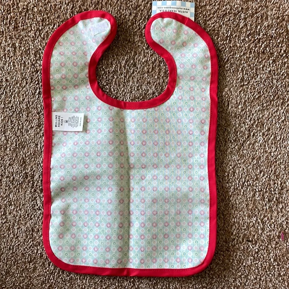 Baby bib with plastic coating on front